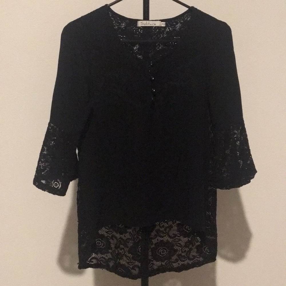 Black top with opening in the back